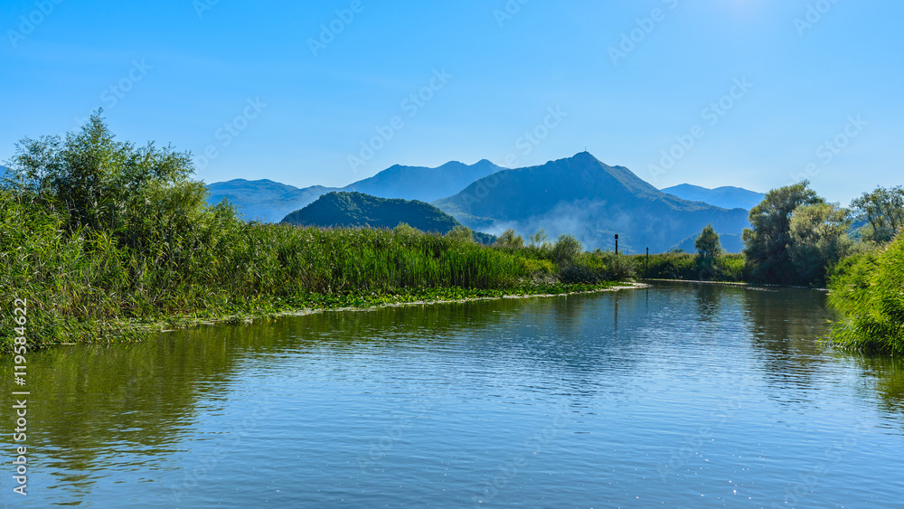A beautiful view of the river, mountain in the haze in the backg A beautiful view of the river, mountain in the haze in the backg
