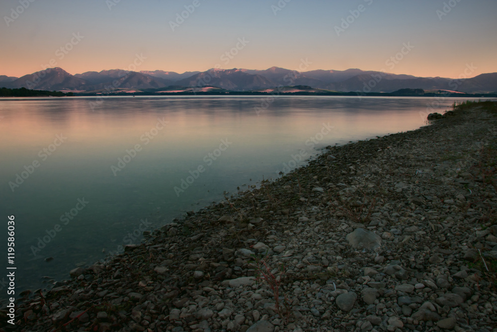 Lake Beach with Mountain Range