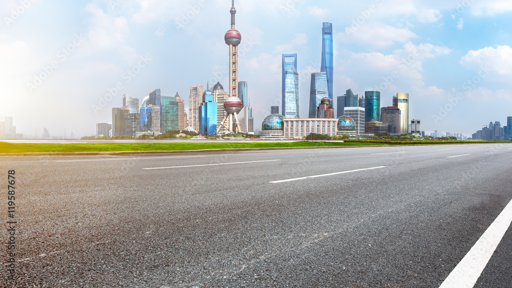 empty asphalt road with cityscape and skyline of Shanghai empty asphalt road with cityscape and skyline of Shanghai