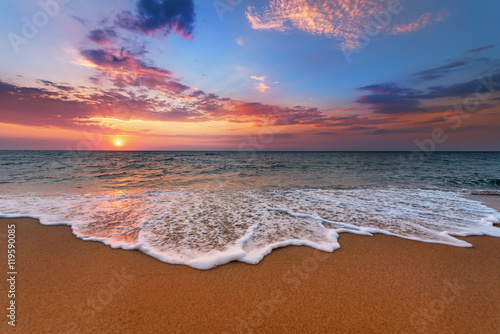 Vászonkép Colorful ocean beach sunrise.