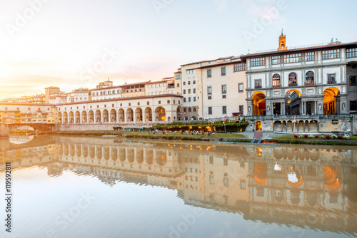 Cityscape view on Arno riverside with Canottiery arch building and Famous Uffizi museum on the sunset in Florence