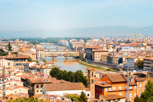 Florence aerial cityscape view from Michelangelo square on the old town and river with bridges in Italy