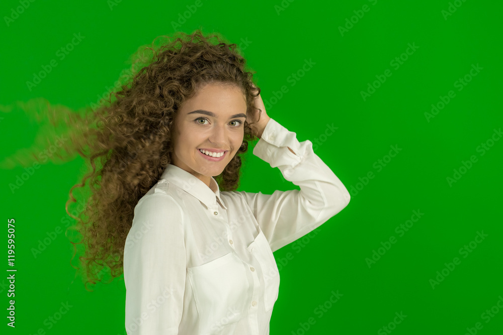 The beautiful woman stand on the green background The beautiful woman stand on the green background