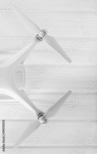 quadrocopter on a white wooden background