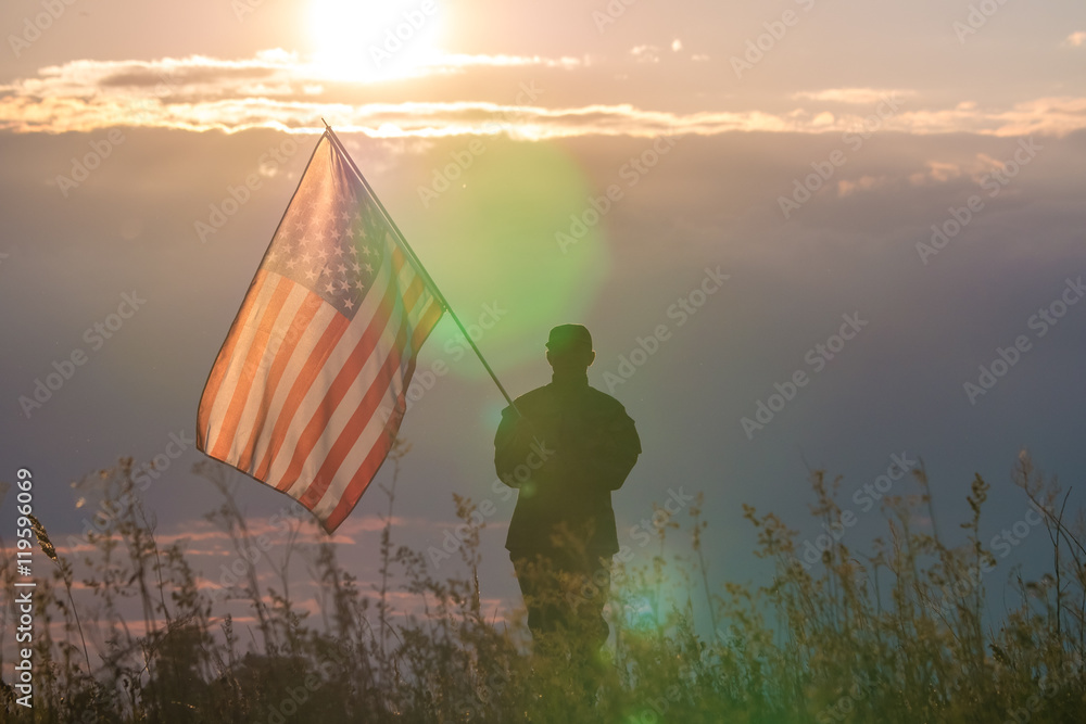 The military stand on the background of sunset with the American flag ...