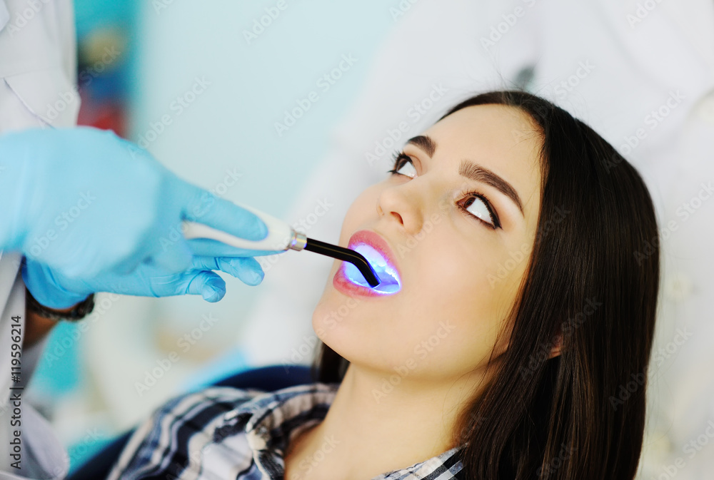 beautiful girl at the dentist. Dental fillings