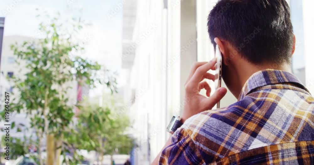 Rear view of a man calling Rear view of a man calling
