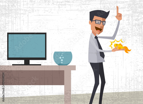 Young businessman holding a goldfish and making a wish