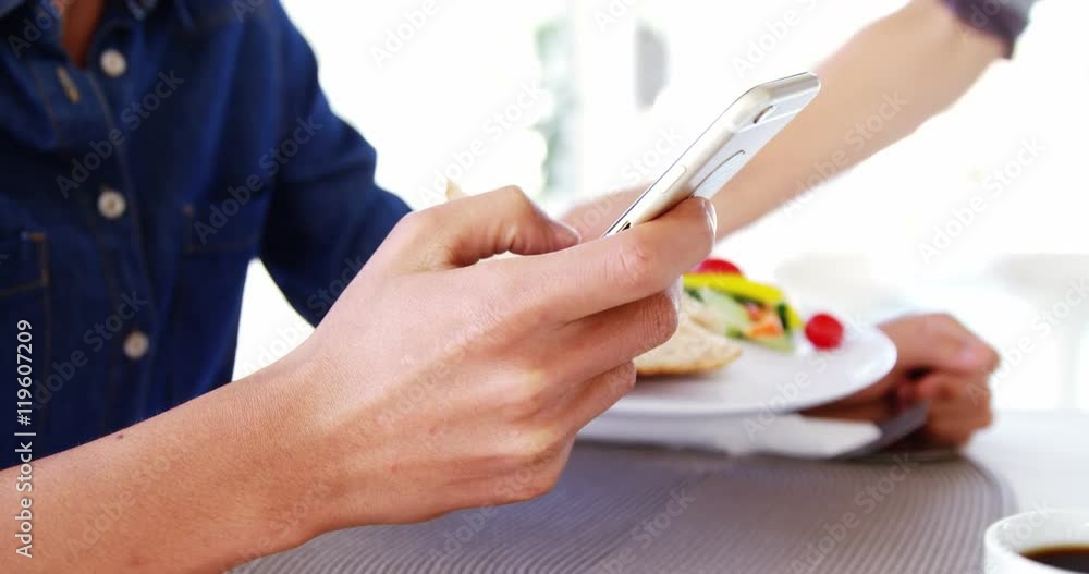 Businessman texting and waiting his lunch Businessman texting and waiting his lunch