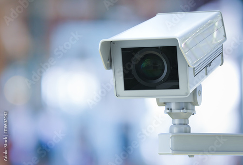 cctv camera or security camera on retail shop blurred background