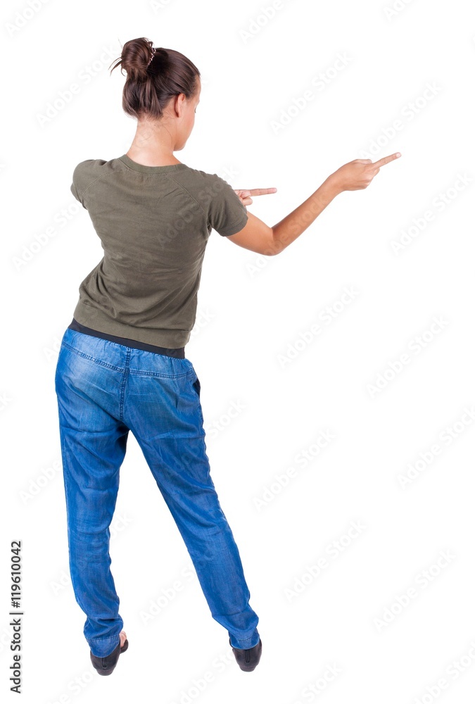 Back view of pointing woman. beautiful brunette girl in jeans. Rear view people collection. backside view of person. Isolated over white background. Back view of pointing woman. beautiful brunette girl in jeans. Rear view people collection. backside view of person. Isolated over white background.