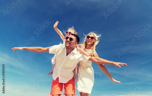happy family having fun over blue sky background