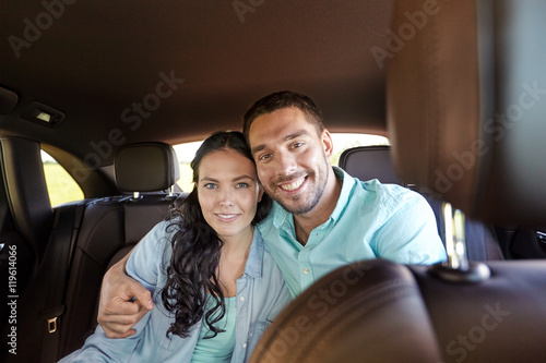 happy man and woman hugging in car © Syda Productions