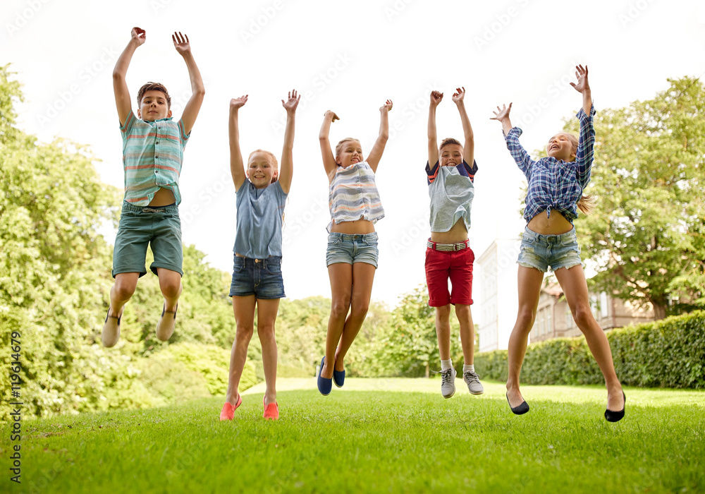 happy kids jumping and having fun in summer park Stock Photo | Adobe Stock