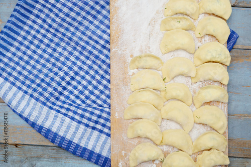 Vareniki dumplings , pierogi before boiling.