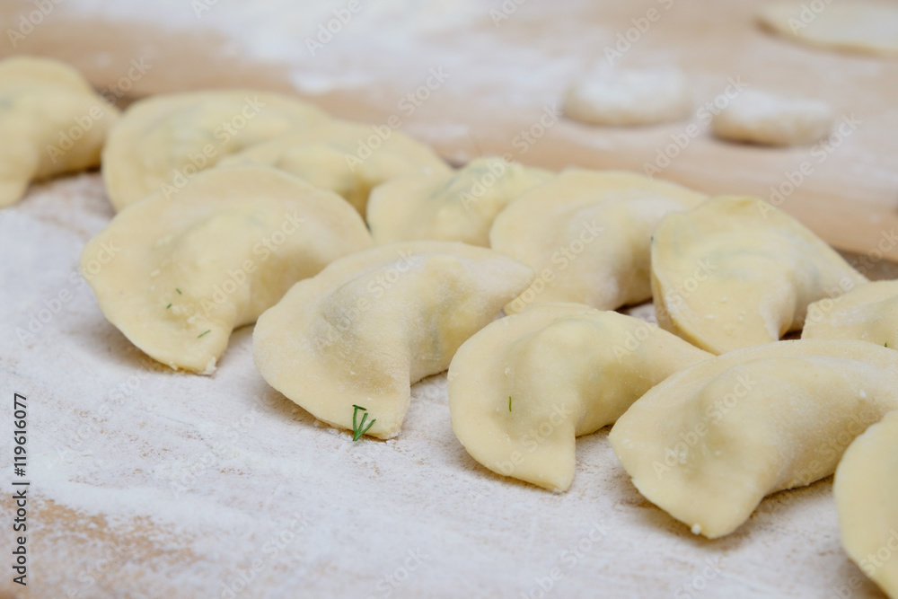 Vareniki dumplings or pelmeni before boiling Vareniki dumplings or pelmeni before boiling