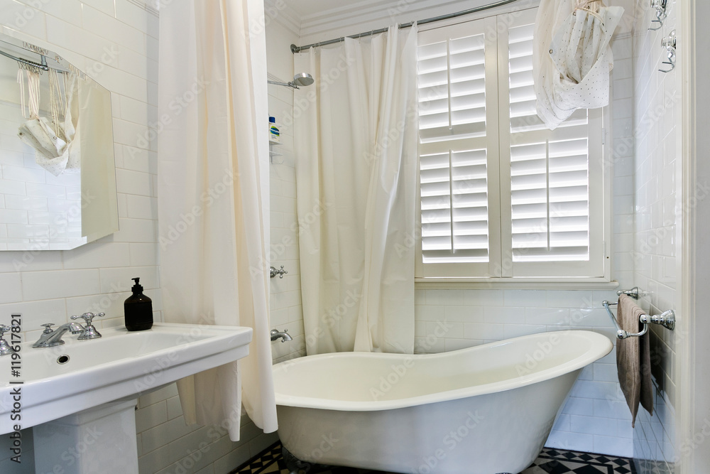 Obraz premium Stylish clean bathroom with shower and bath tub