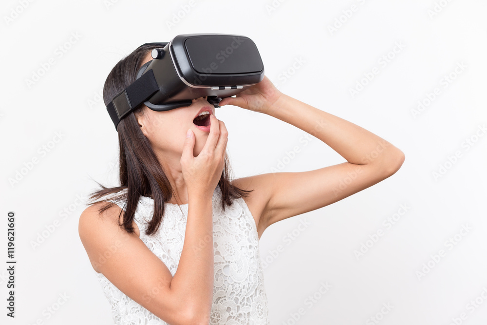 Woman watching with VR device and feeling surprise Woman watching with VR device and feeling surprise