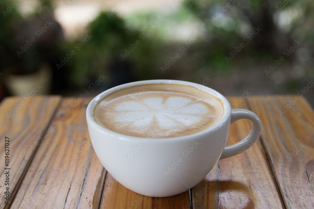Cup of cappuccino art coffee with froth shape flower Cup of cappuccino art coffee with froth shape flower