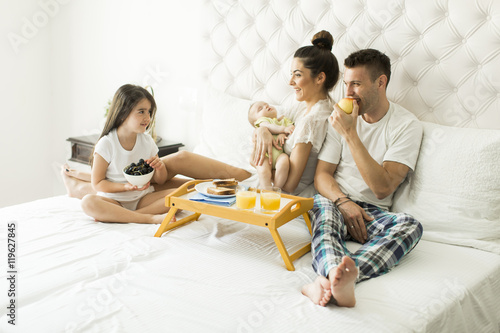 Young familly on the bed