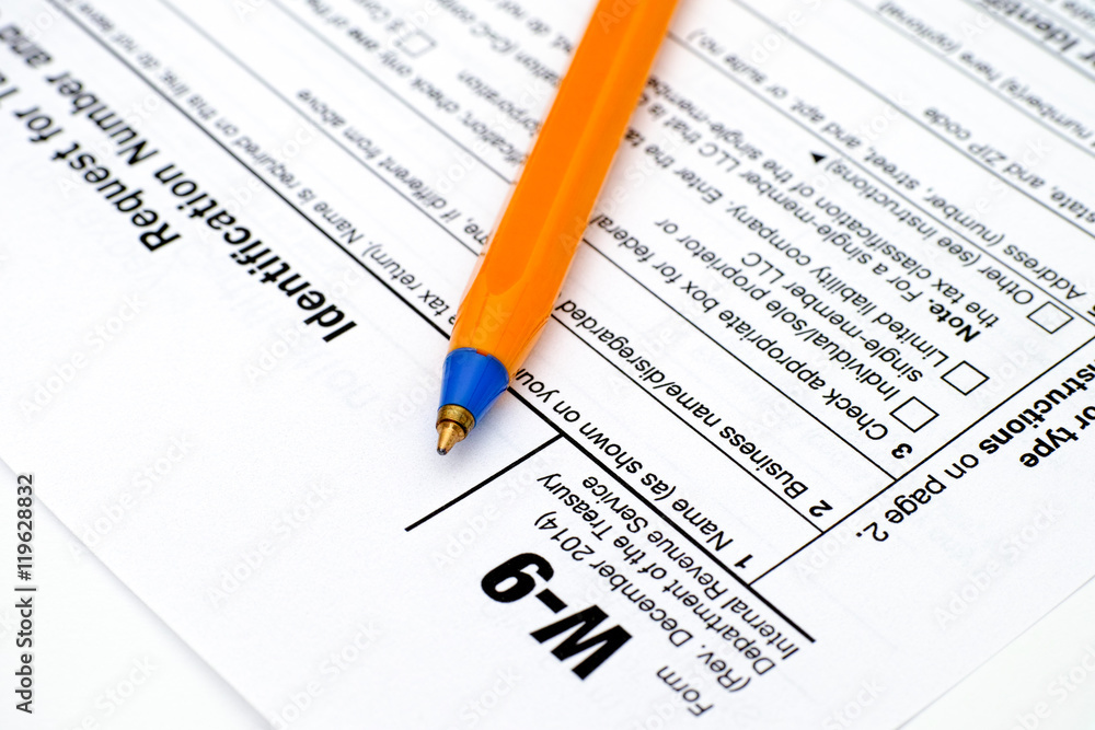 Application form W-9, Request for Taxpayer Identification Number (TIN) and Certification with ballpoint pen. Application form W-9, Request for Taxpayer Identification Number (TIN) and Certification with ballpoint pen.