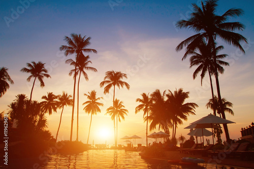 summer holidays  paradise tropical beach background  luxurious hotel at sunset