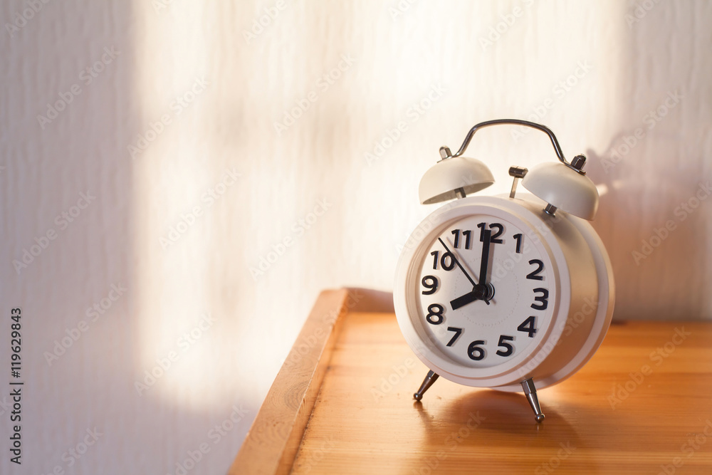 eight o'clock in the morning, alarm clock on bedside table eight o'clock in the morning, alarm clock on bedside table