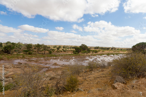 African Landscape of open savanna and river on sunny day, Tsavo