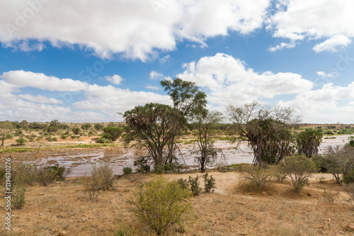 African Landscape of open savanna and river on sunny day, Tsavo