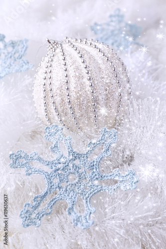 New Year composition: crochet snowflakes and large Christmas bal