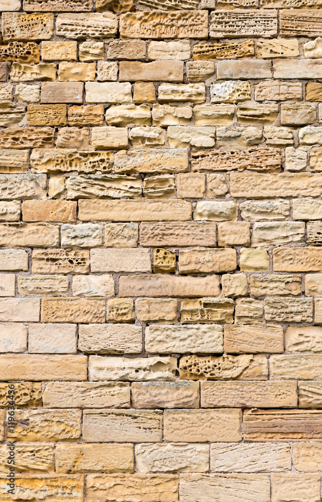 Fototapeta premium Eroded sandstone block wall