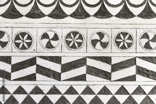 Fototapeta Naklejka Na Ścianę i Meble -  Hand-carved wall background decorated with local motifs in Pyrgi, Chios Island, Greece.
