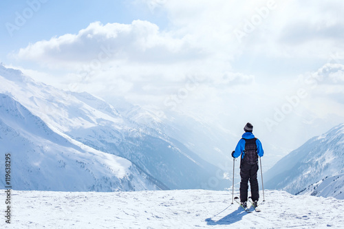 skiing background, skier in beautiful mountain landscape, winter holidays in Alps