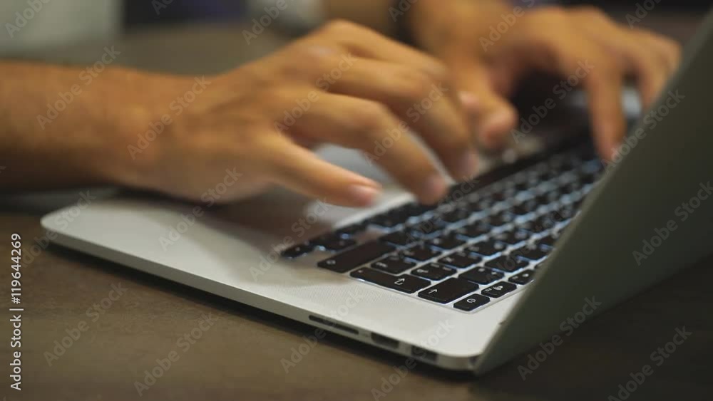 Closeup of businessman typing on laptop computer Closeup of businessman typing on laptop computer