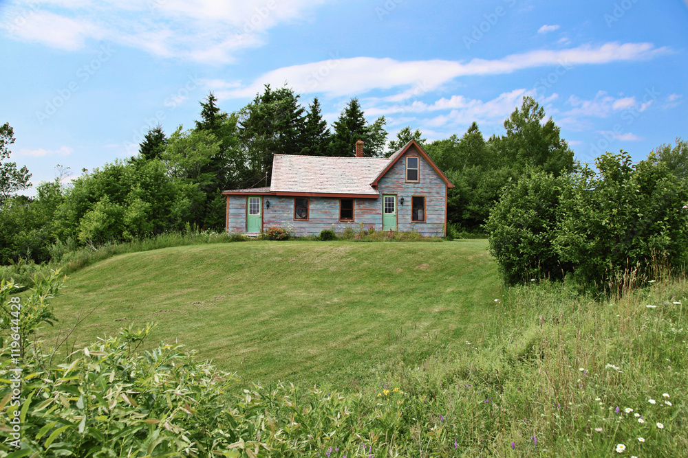 Old home with landscaped front yard in Summer Old home with landscaped front yard in Summer