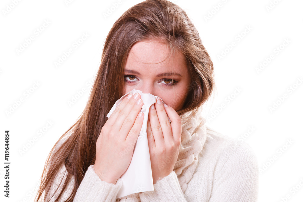 Sick woman girl with fever sneezing in tissue Sick woman girl with fever sneezing in tissue