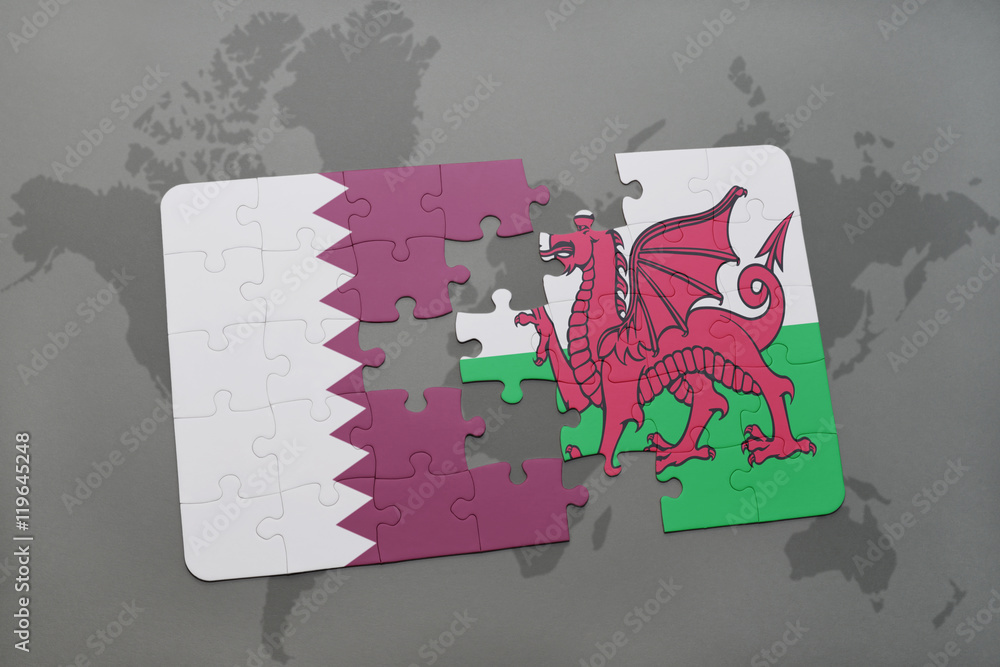 puzzle with the national flag of qatar and wales on a world map ...