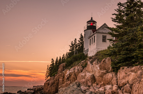lighthouse on rocky coast © arburkholder
