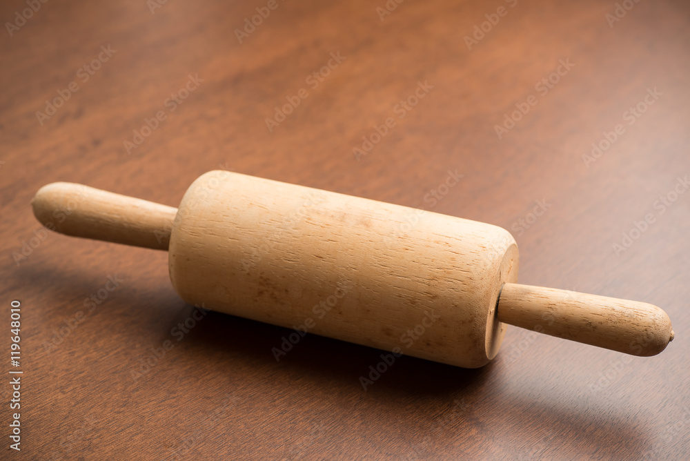 Rolling pin on wooden background