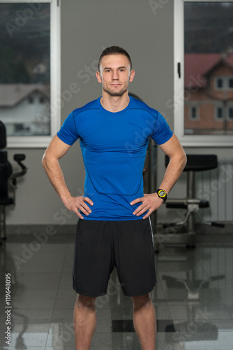 Handsome Personal Trainer Wearing Sportswear In Fitness Center
