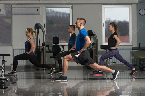 Group Of Sportive People In A Gym Training