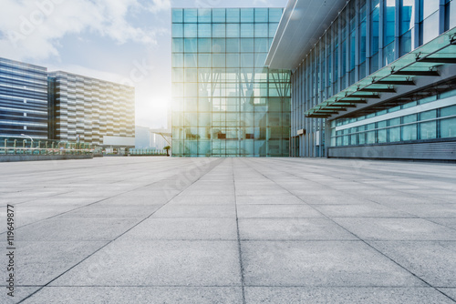 empty brick floor with modern building in background