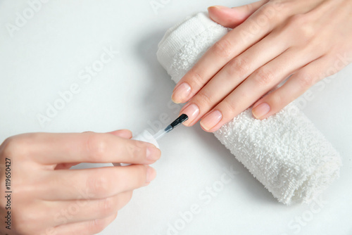 Woman getting nail manicure.