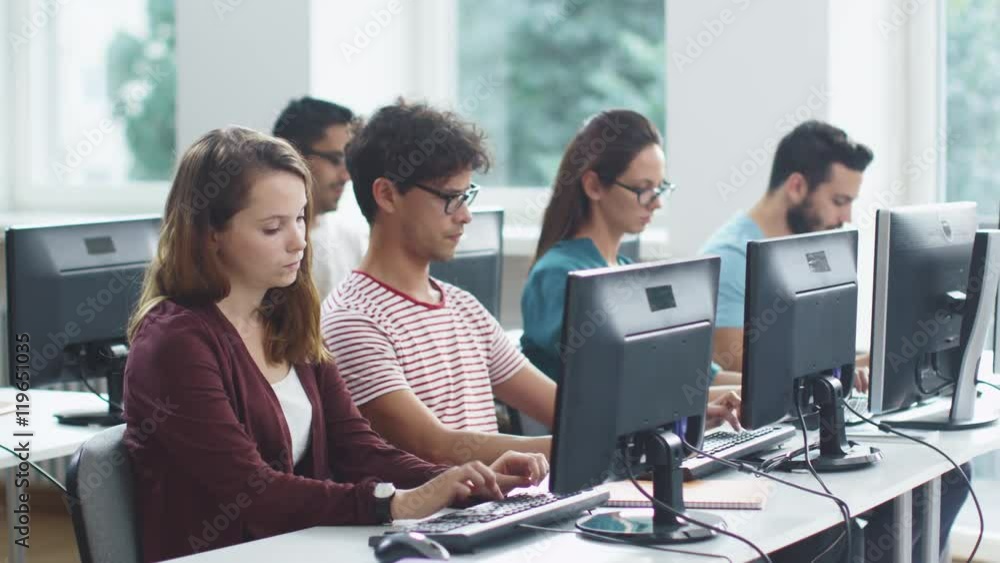 Group of Mixed Race Students working on Computer during Lecture. Shot on RED Cinema Camera in 4K (UHD). Group of Mixed Race Students working on Computer during Lecture. Shot on RED Cinema Camera in 4K (UHD).