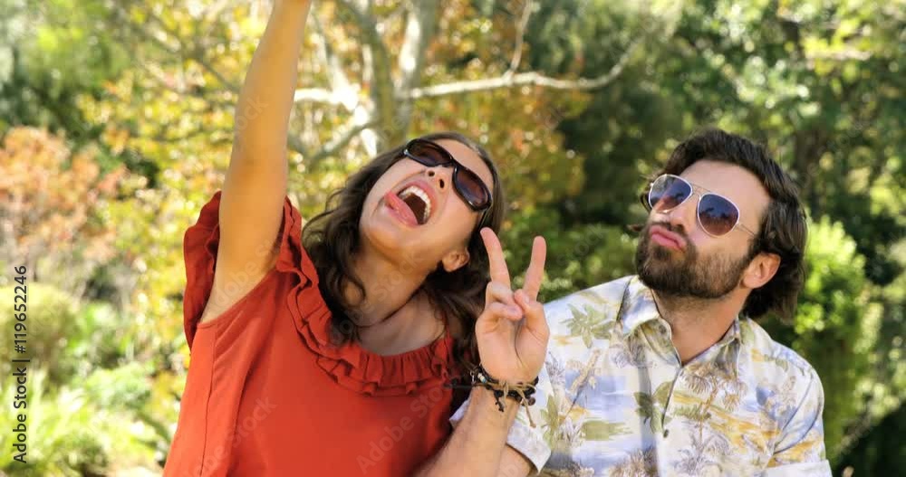 Hipster couple taking a selfie Hipster couple taking a selfie