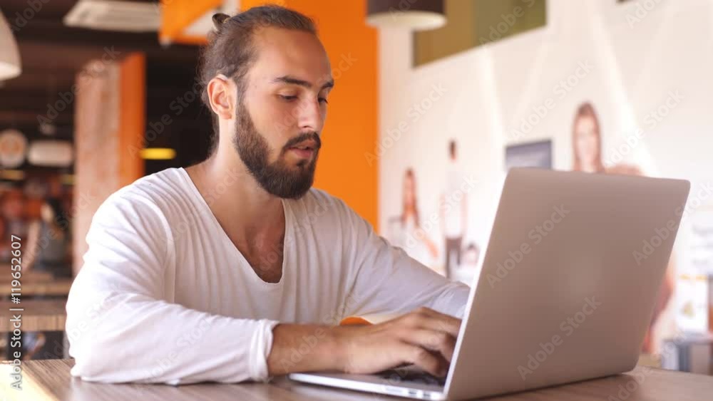 Handsome businessman working in the cafe during lunch Handsome businessman working in the cafe during lunch