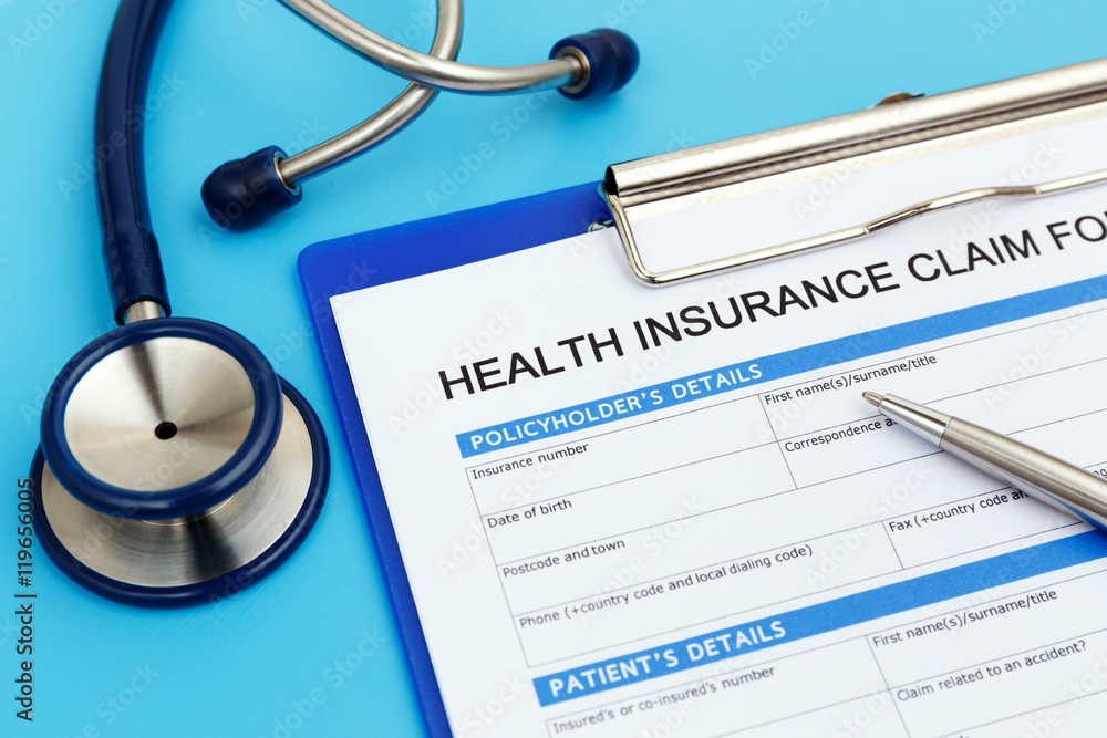 Health insurance claim form with pen and stethoscope Health insurance claim form with pen and stethoscope