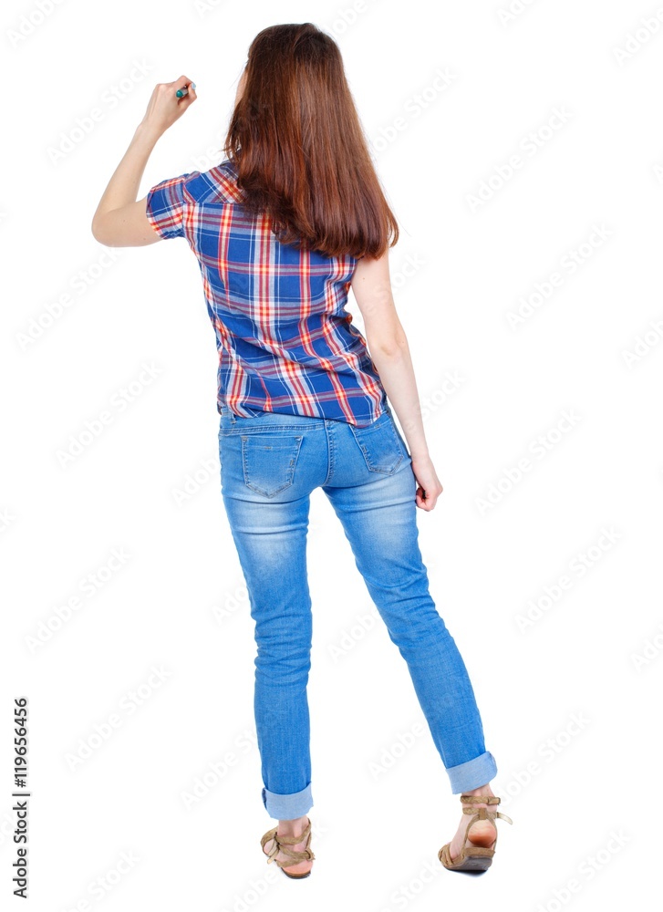 back view of writing beautiful woman. Girl in plaid shirt stands with his back and wrote marker back view of writing beautiful woman. Girl in plaid shirt stands with his back and wrote marker