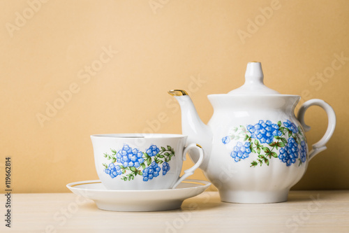 Cup of tea with teapot in vintage style