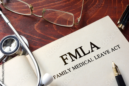 Page with FMLA family medical leave act on a table. photo
